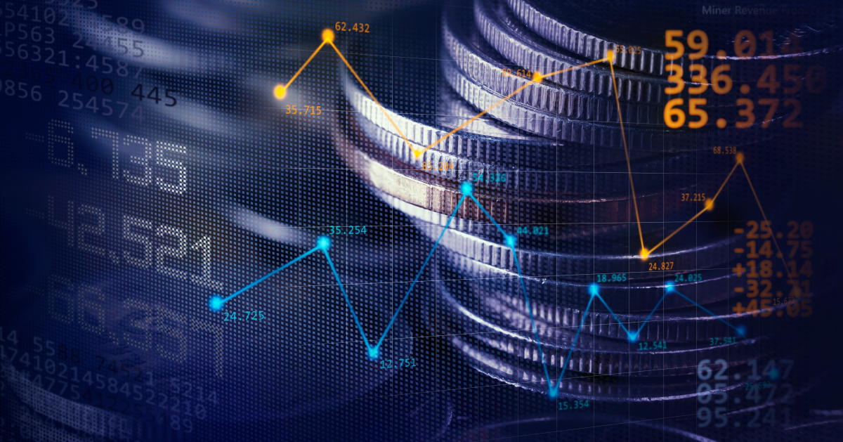 Monedas delante de gráfico de inversiones financieras